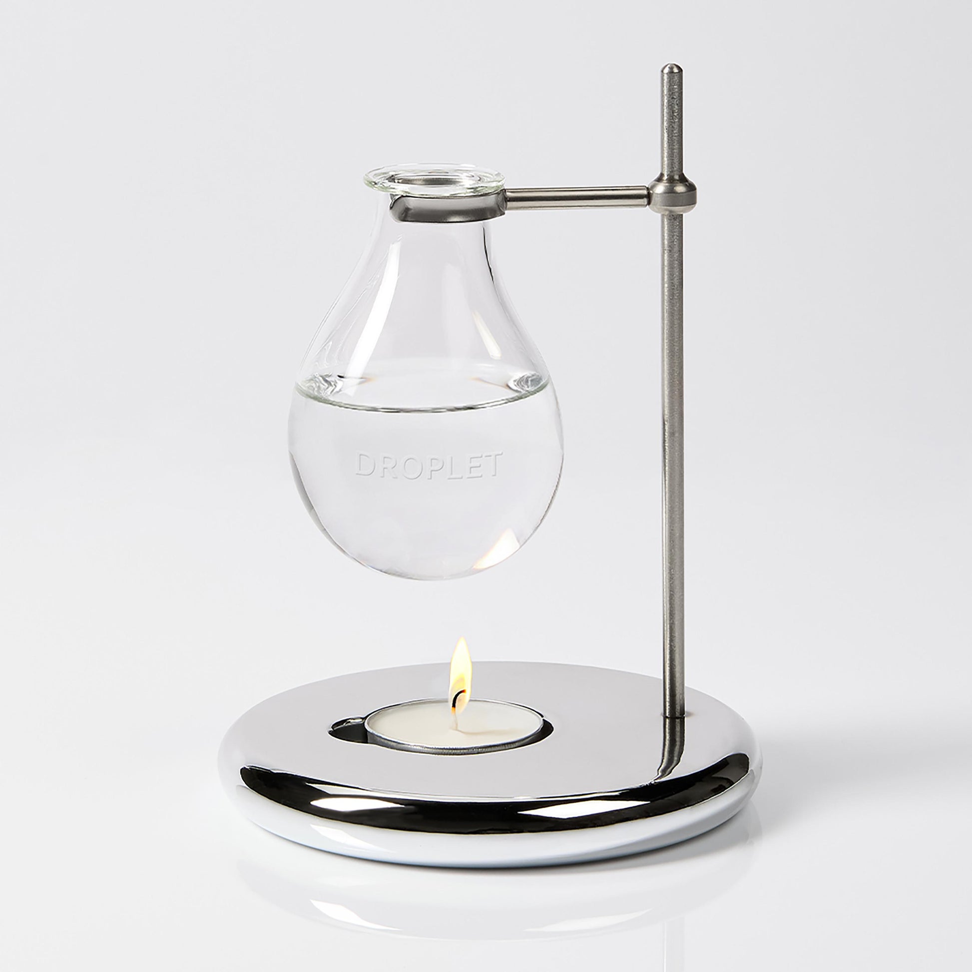 Scent Burner 1x hand blown glass vessel, 1x chrome stand and base, 8x tea light candles
